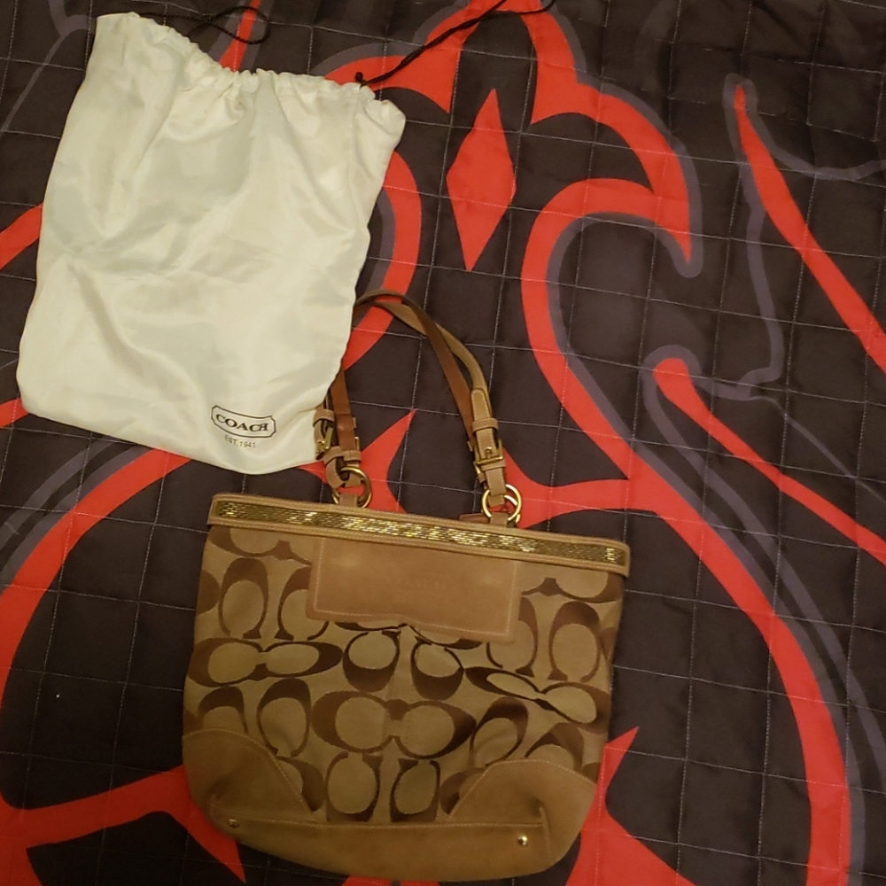 Coach purse with storage bag.